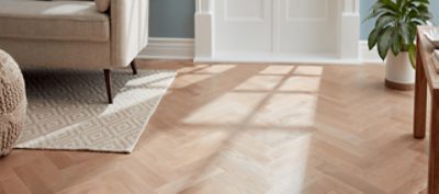 A room with stained hardwood floors.