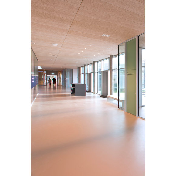 A brightly-lit corridor with a glossy resin floor.