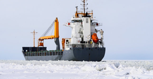 Cargo ship in icy waters.