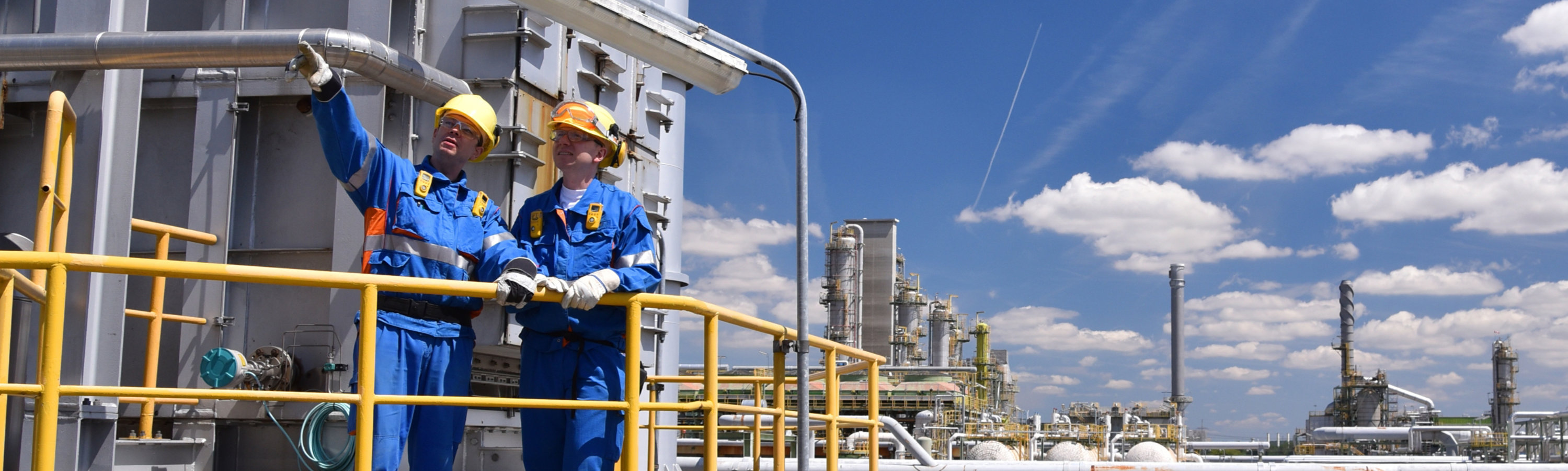 Two workers on an offshore oil and gas platform
