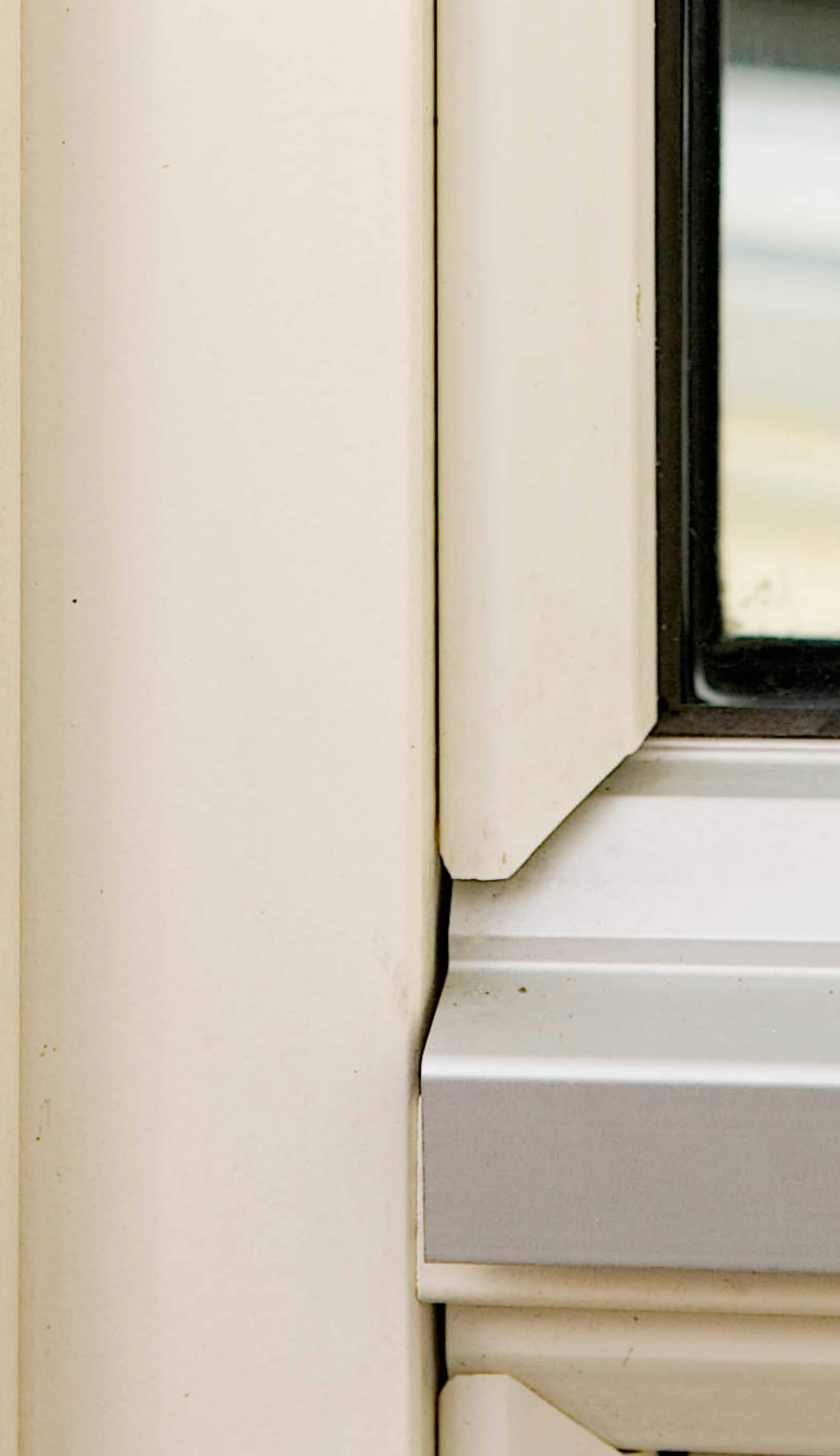 Detail of insulated wood window frame with glass panel and precision finish