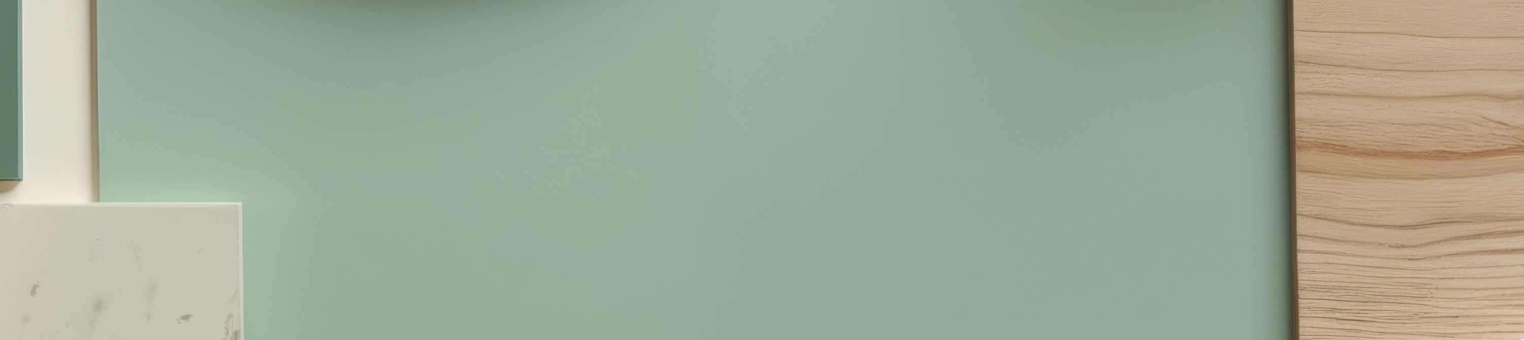 Flat lay of green marble and wood samples in various shapes and textures.