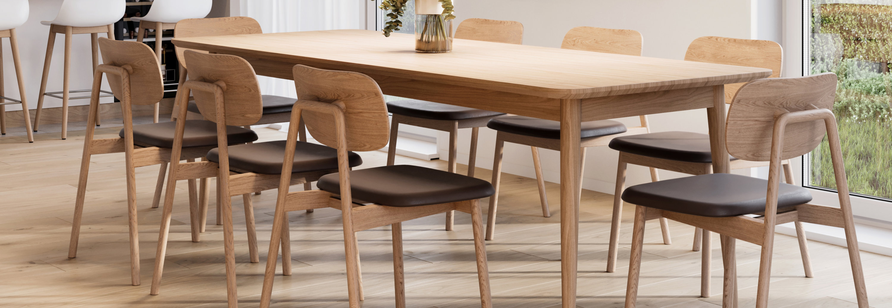 Contemporary kitchen and dining space with light wood cabinetry and furniture, showcasing natural wood finishes and bright interior design.