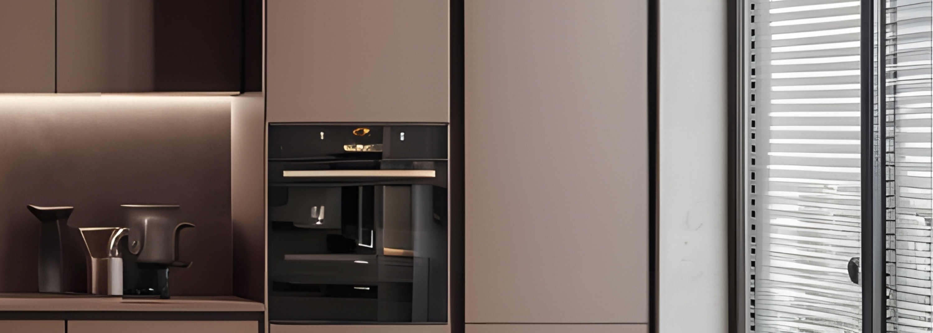 Modern brown kitchen with central island, built-in appliances, and natural light from large windows.
