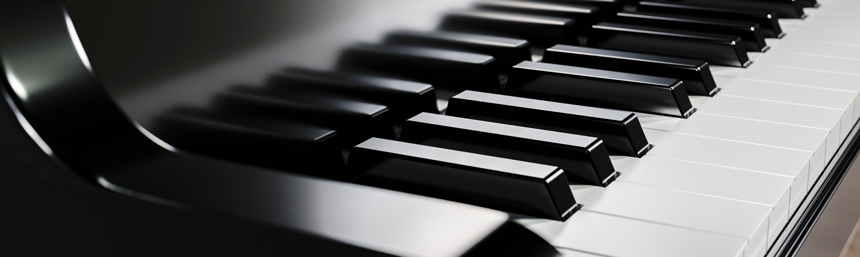 Close-up of polished piano keys with black keys in focus.