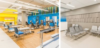 Basement-level therapy center with wood floors, exposed ceiling, bar lighting, and bright accent walls in yellow and blue with therapy equipment arranged throughout.