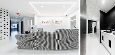 Lobby or reception area and examination room in dental specialty center featuring bright white walls with black accents and bright lighting.