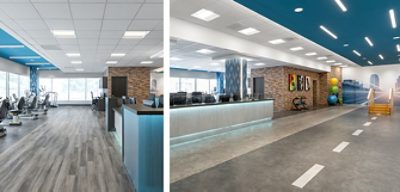 Physical therapy fitness center with blue painted accents, therapy equipment, and architecturally lit front desk.