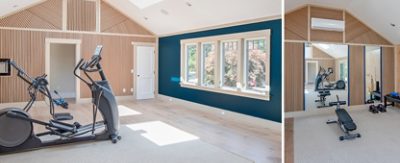 Modern fitness room with exercise equipment, wooden slat walls, Sherwin-Williams Anchors Aweigh accent wall, and large windows.