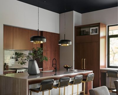 Modern kitchen with central island, wooden cabinetry, and pendant lighting with Sherwin-Williams Alpaca walls and Tricorn Black ceiling. 
