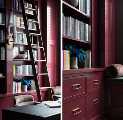 A Sherwin-Williams Burgundy-painted library with bookshelves, a wooden ladder, and a window seat with white shutters.