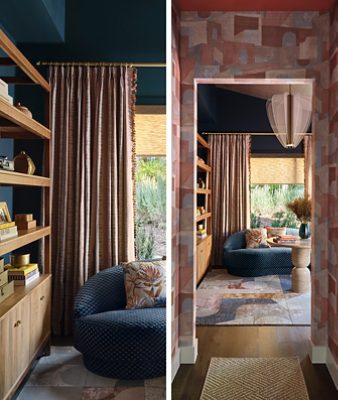 Cozy interior seating nook with a dark blue sofa, round table, abstract rug, and artistic light fixture with walls painted Dark Night and ceiling in Henna Shade. 