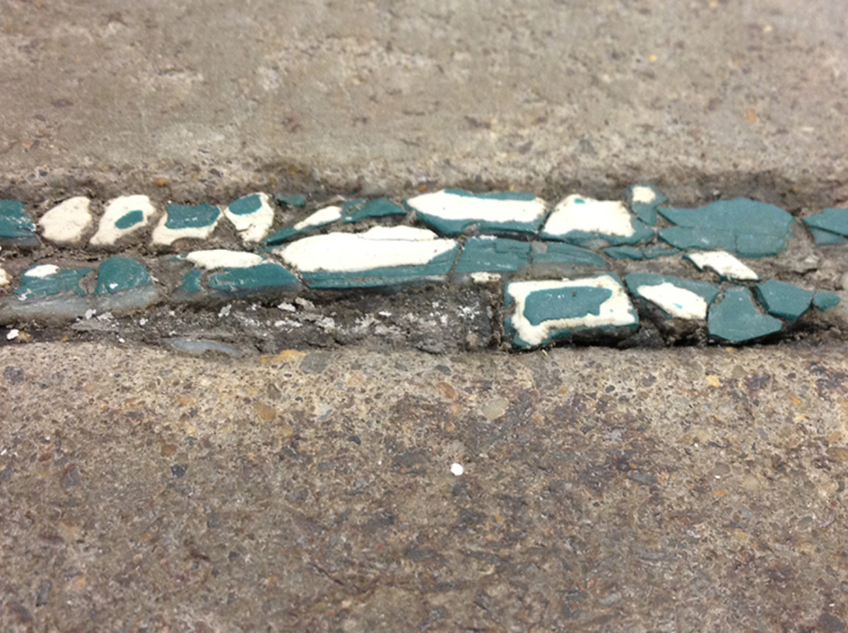 A joint in concrete that needs repair.