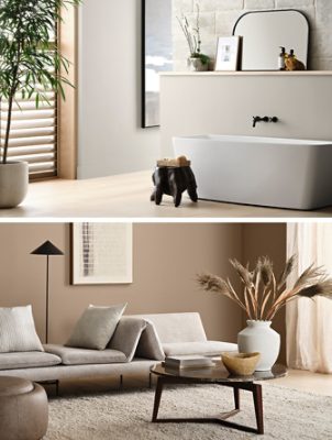 Top image: White freestanding bathtub in front of stone wall with light wood floors, Mindful Gray walls, and wood slat blinds in tall windows. Bottom image: Sitting area with modern upholstered sofa, marble-topped coffee table, and walls in the color Mexican Sand.