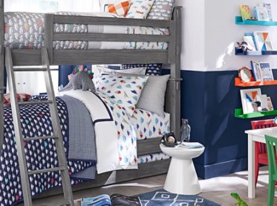 A dinosaur themed bedroom with bunk beds and navy blue walls.