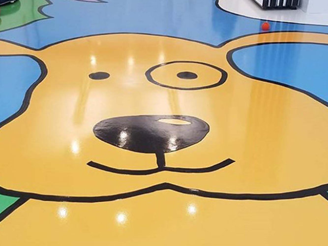 A creative resinous floor showing a dog face