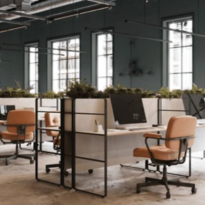 An industrial office with open concept desks.