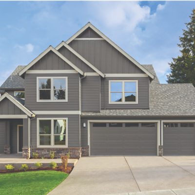 An old Victorian house with double doors and arched windows.
