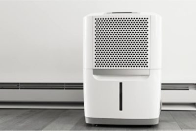 A photo of a humidifier placed on the floor in a room.
