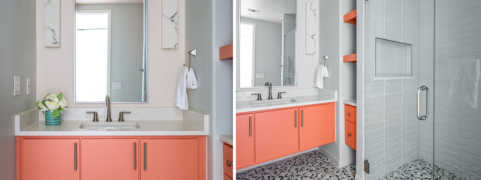 Bathroom with neutral gray color scheme and bright coral-colored vanity cabinets near a glassed-in shower.