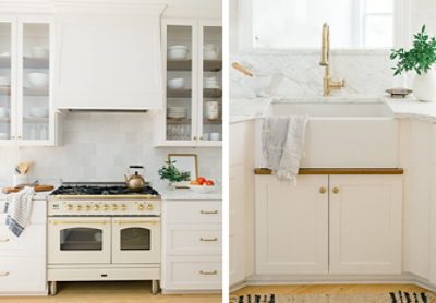Left image: Shot of warm white oven and gas range with copper tea kettle, flanked by glass-front ceiling-height cabinets. Right image: White farmhouse sink and marble backsplash with brassy metallic faucet and cupboard door pulls.