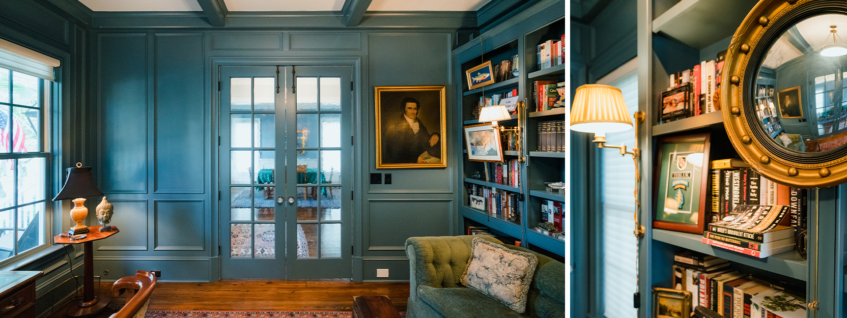 Muted blue color-drenched home library space with coffered ceilings, wood floors, tufted settee, painted portrait hanging next to French doors.