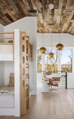 Modern loft bedroom with a wooden bunk bed, gold pendant lights, and large windows with a wood slat ceiling and Pure White walls.