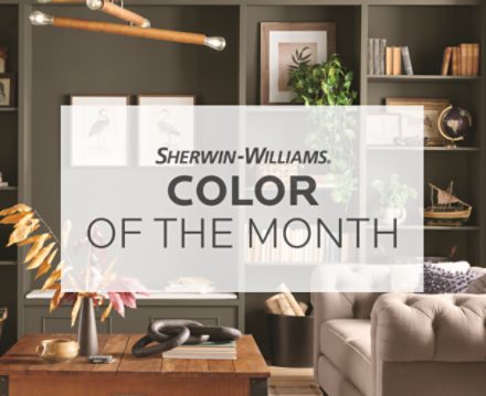 Sherwin Williams Color of the Month text over a living room with Roycroft Bronze Green painted on the walls.