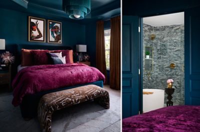 A luxurious bedroom with dark teal walls, a magenta bed, and abstract art, adjoining a marbled bathroom with gold fixtures. 