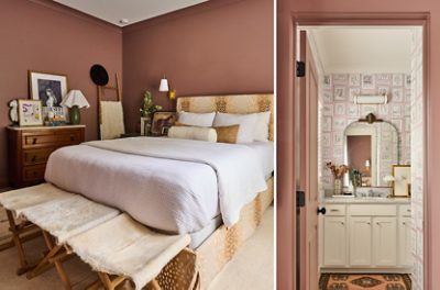 Inviting and warm-toned bedroom color-drenched in Sherwin-Williams Dutch Cocoa with a plush bed and decor next to a bathroom with pink-patterned wallpaper and a white vanity. 