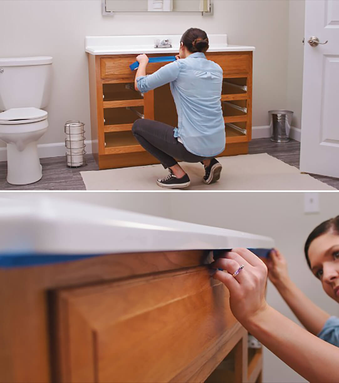 A woman is using painter's tape to mask a bathroom vanity before painting.
