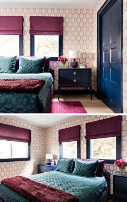 Guest bedroom with patterned wallpaper, teal and maroon bedding and window treatments, and navy painted trim and doors.