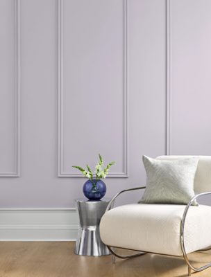 Wall with panel moulding painted in Grape Mist SW 6548.