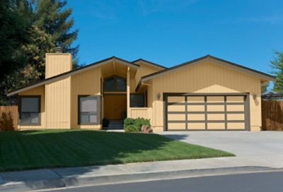 A modern style home with yellow paint and asymmetric roofing. S-W colors featured: SW 2834, SW 6173, SW 7700