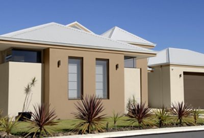 A modern style home with beige and brown paint and slate gray roofing. S-W colors featured: SW 6148, SW 7540, SW 7034