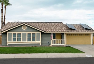 A modern style home with grayish blue paint and a dark gold garage. S-W colors featured: SW 6207, SW 6134, SW 6409