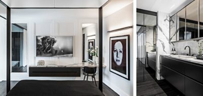 Black and white color scheme throughout residential interior with white walls, black furnishings, black and white photography and wall art, and marble accents.