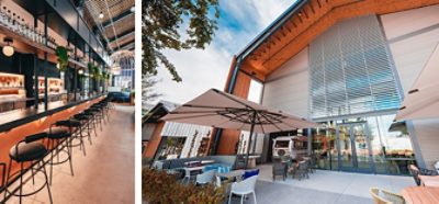 Left image: Bar area of Las Vegas food hall with warm lighting, greenery, black bar stools and high ceiling. Right image: Exterior shot of food hall with patio seating under large rectangular umbrellas.