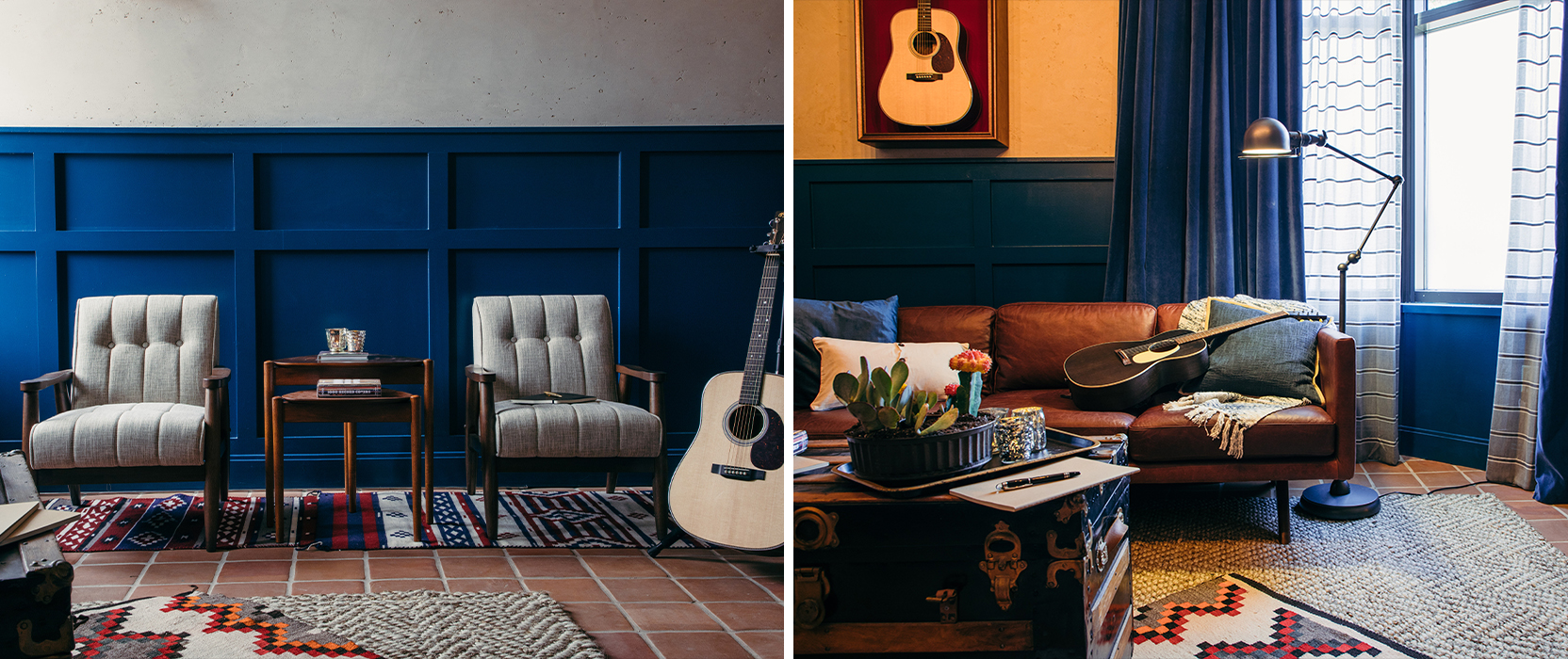 Left image: Two gray tufted chairs with wood frames and a shared accent table situated on woven rugs in front of a board-and-batten wall in a rich blue color, with an acoustic guitar on a stand off to the side.  Right image: Brown leather sofa with throw pillows, blanket and a black acoustic guitar arranged on top, industrial floor lamp and trunk used as a coffee table in foreground.