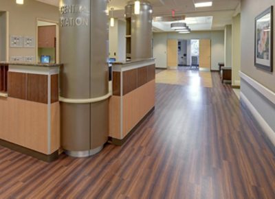 Healthcare station with columns and vinyl wood flooring.