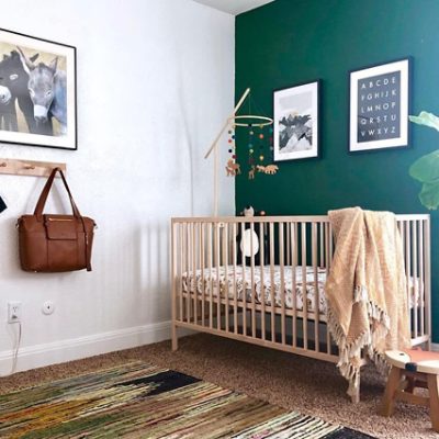 A nursery with green wall paint