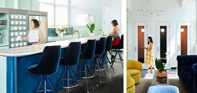 High-ceilinged modern workplace kitchen area with dark blue velvet swivel stools at bar-height blue island.