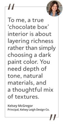 Graphic featuring the quote “To me, a true ‘chocolate box’ interior is about layering richness rather than simply choosing a dark paint color. You need depth of tone, natural materials, and a thoughtful mix of textures,” by Kelsey McGregor, principal designer of Kelsey Leigh Design Co.