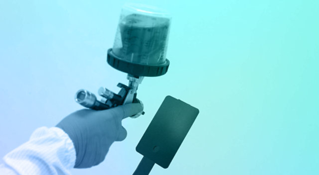 Person operating a spray gun.