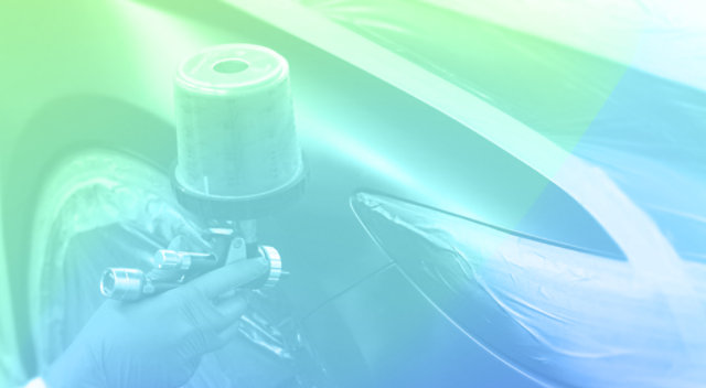 Paint application via a spray gun