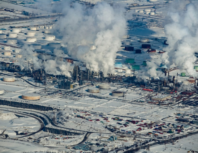 snow covered oil refinery in the winter