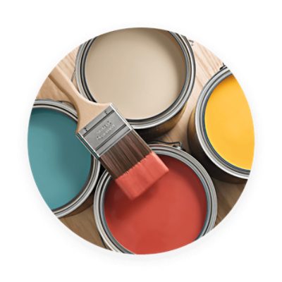 Four full, open paint cans with a brush laying across the top.