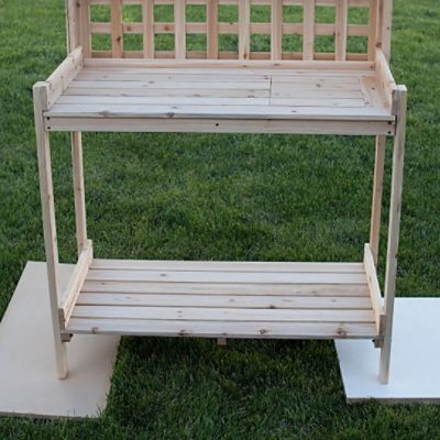 An outdoor wooden plant stand before being painted