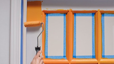 Painting a home office door orange with a roller. SW featured colors: SW 6887.
