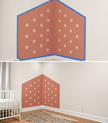 A nursery corner painted with pink paint and white polka dots